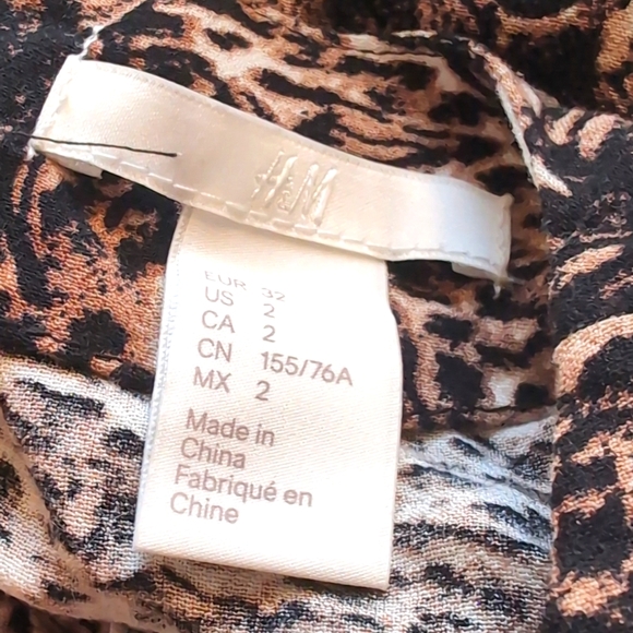 H&M dress, Size 2. White with brown cat pattern. - Picture 8 of 9